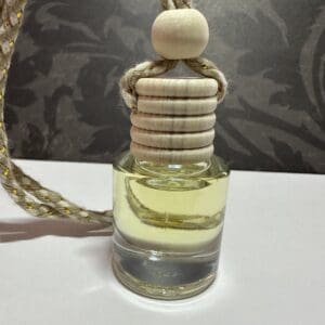 A bottle of perfume with a rope attached to it.