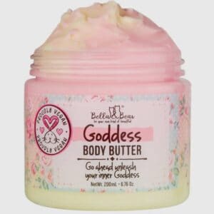 A jar of bealls & bear goddess body butter labeled "100% vegan" with pink whipped cream-like lotion on top.
